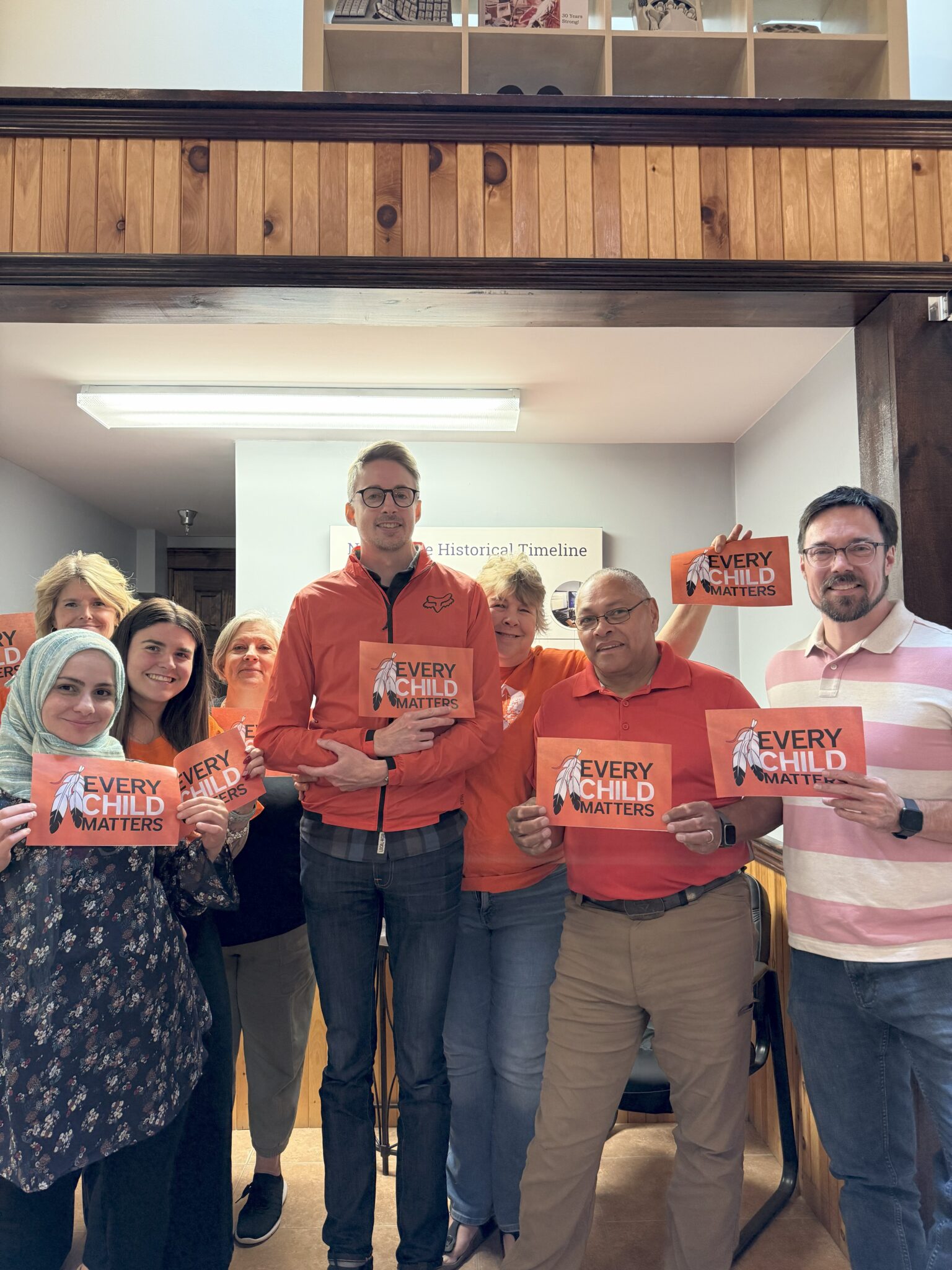 Our Fredericton office wearing orange shirts.