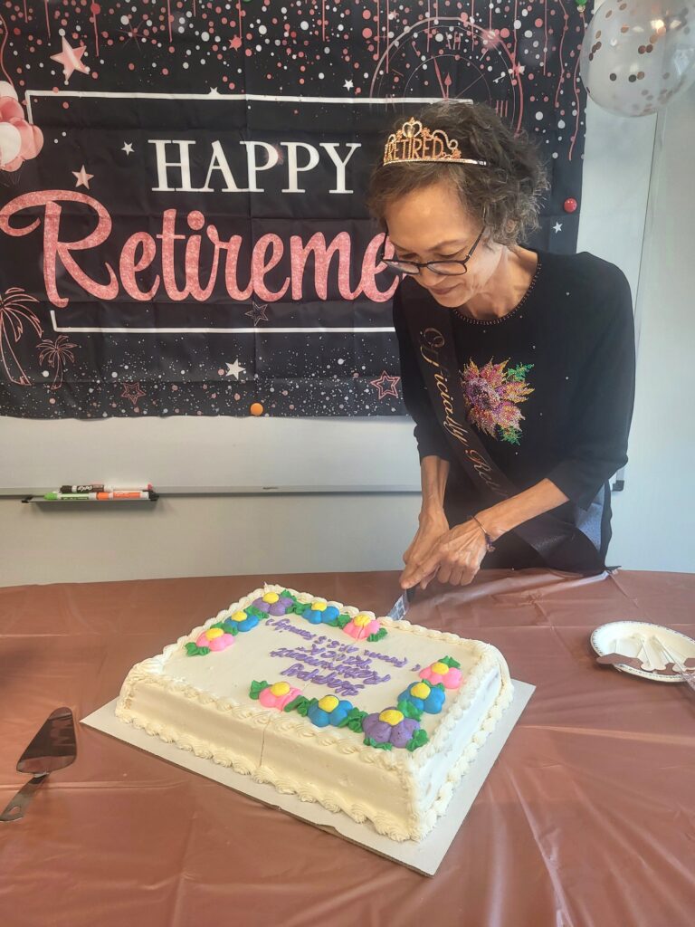 Kiock cutting the cake.