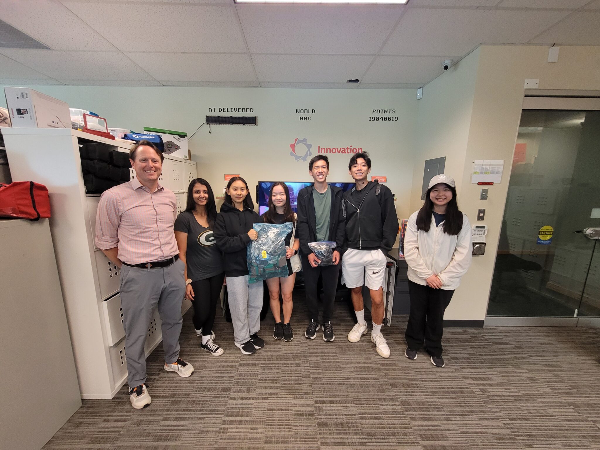 Left to right: Director of Makers Making Change Justin Pezzin and CPABC Director of Operations Denzil Hunt receive donated devices from “STEM Club” Clubs That Care volunteers Jenny, Alyssa, Ethan, Joaquin, and Sandra.