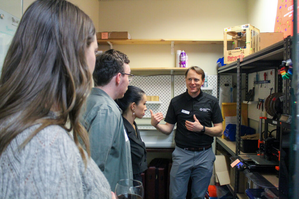 Justin demonstrating the 3D printer room to guests.