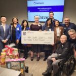 RBC staff members, Burnaby Board of Trade president and CEO Angie Whitfield, Neil Squire staff Gary Birch, Nate Toevs, and Chad Leaman hold the $250,000 cheque.