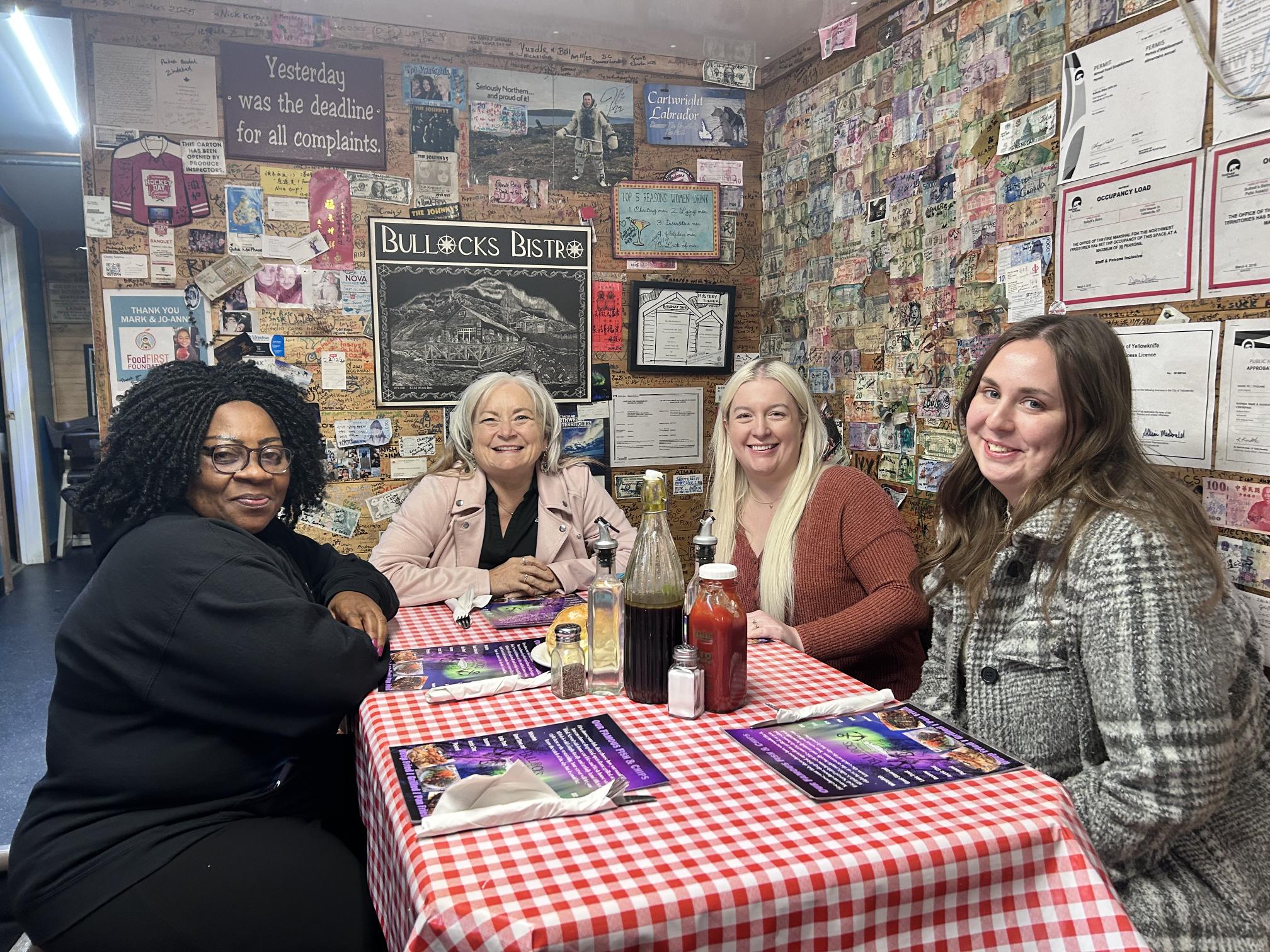 Mercy, Nikki, Chelsea, and Amanda at a diner.