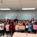 Students and teachers at École Anna-Malenfant with staff from Neil Squire and Place aux compétences.