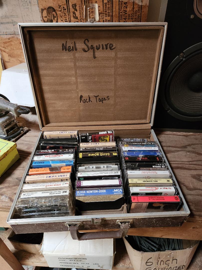 A case with Neil's cassettes, including many 70's and 80's classics.