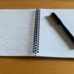 A notebook and a pen.