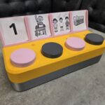 The Chatterbox, with 4 internal switches and picture diagrams for four messages.