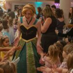 A Storybook Princess high fiving kids in attendance.