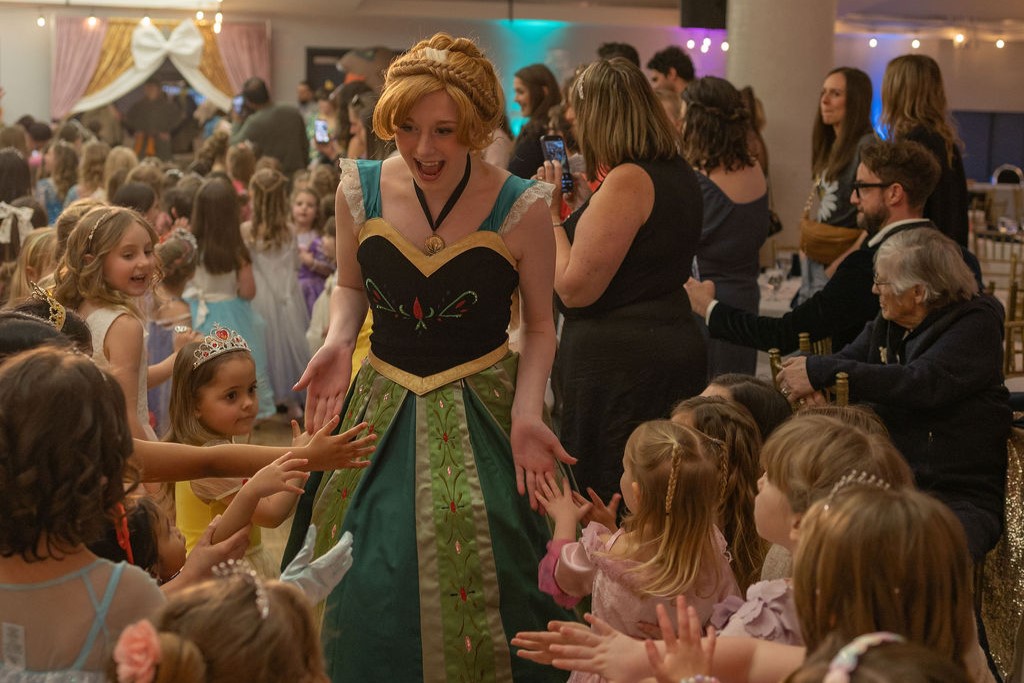 A Storybook Princess high fiving kids in attendance.