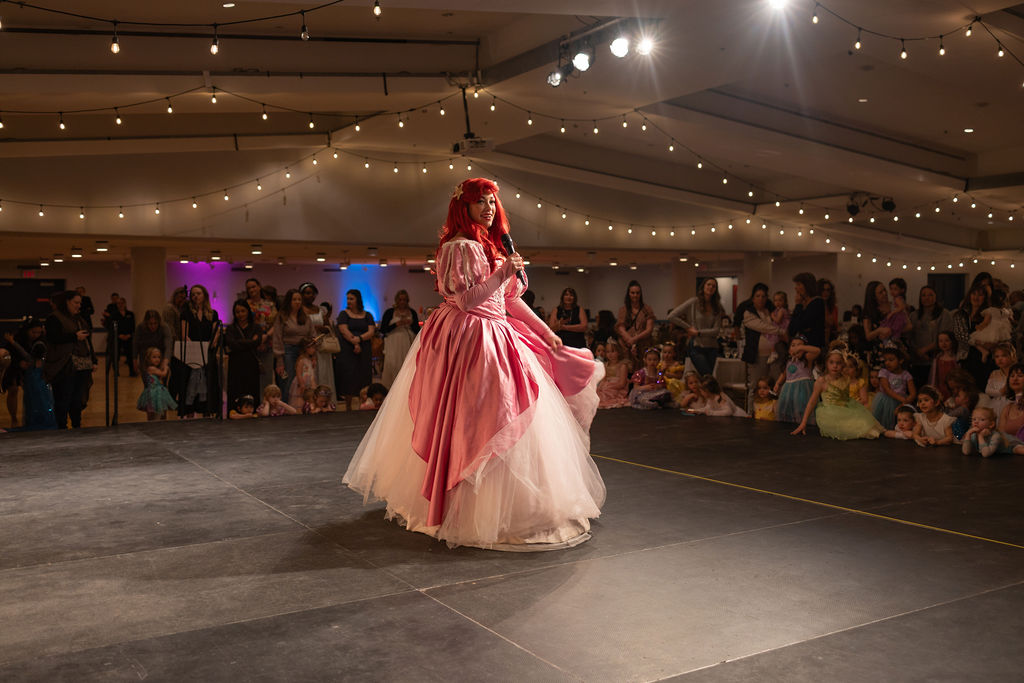 A princess on stage performs.