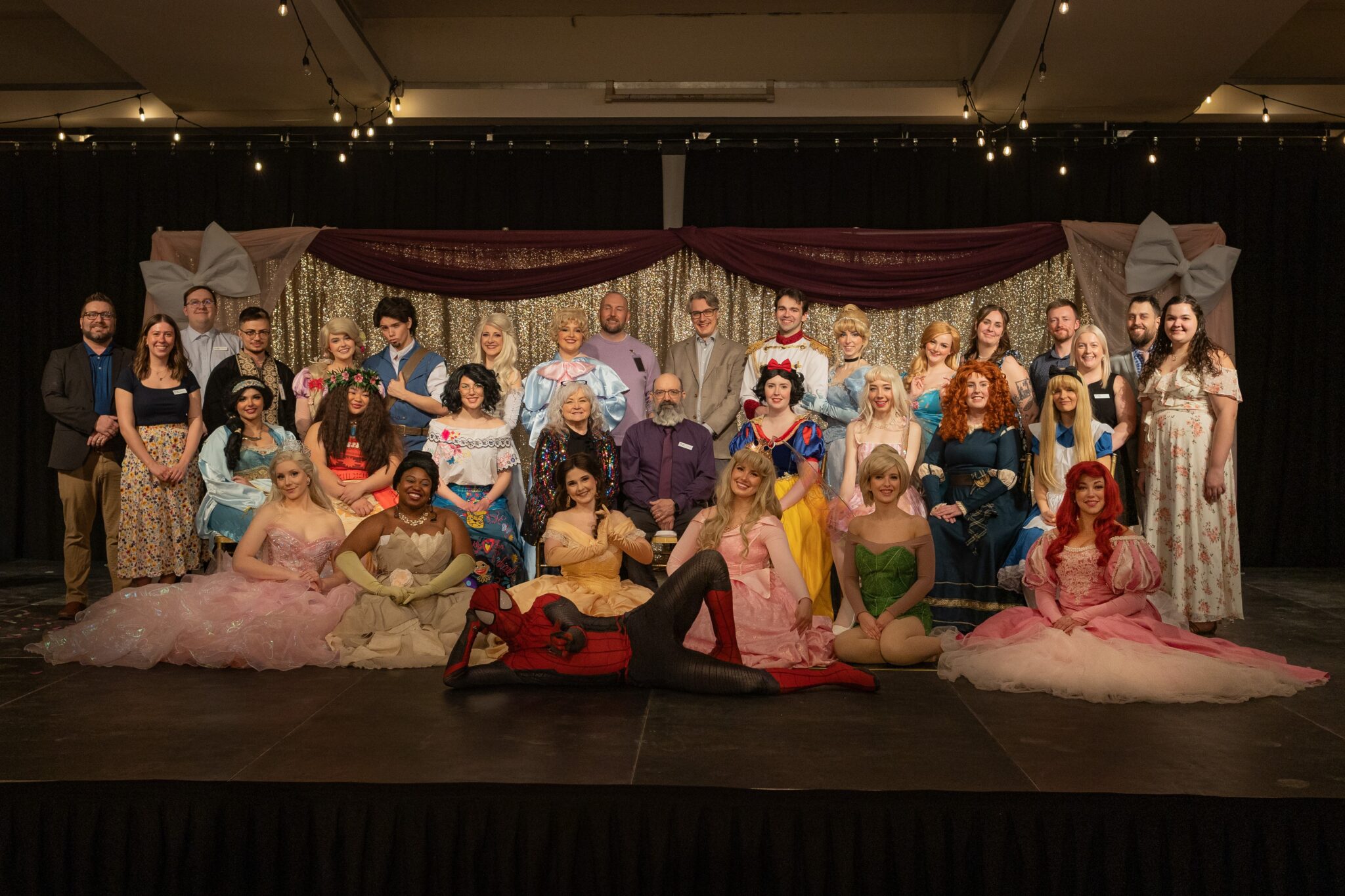 Neil Squire staff pose for a group photo with the Storybook Princesses.