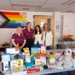 Chelsea, Amanda, and clinicians during a kit delivery.