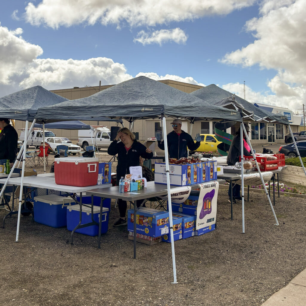 Neil Squire staff get food ready under the tent.