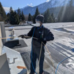 Narada doing HVAC work on a rooftop.