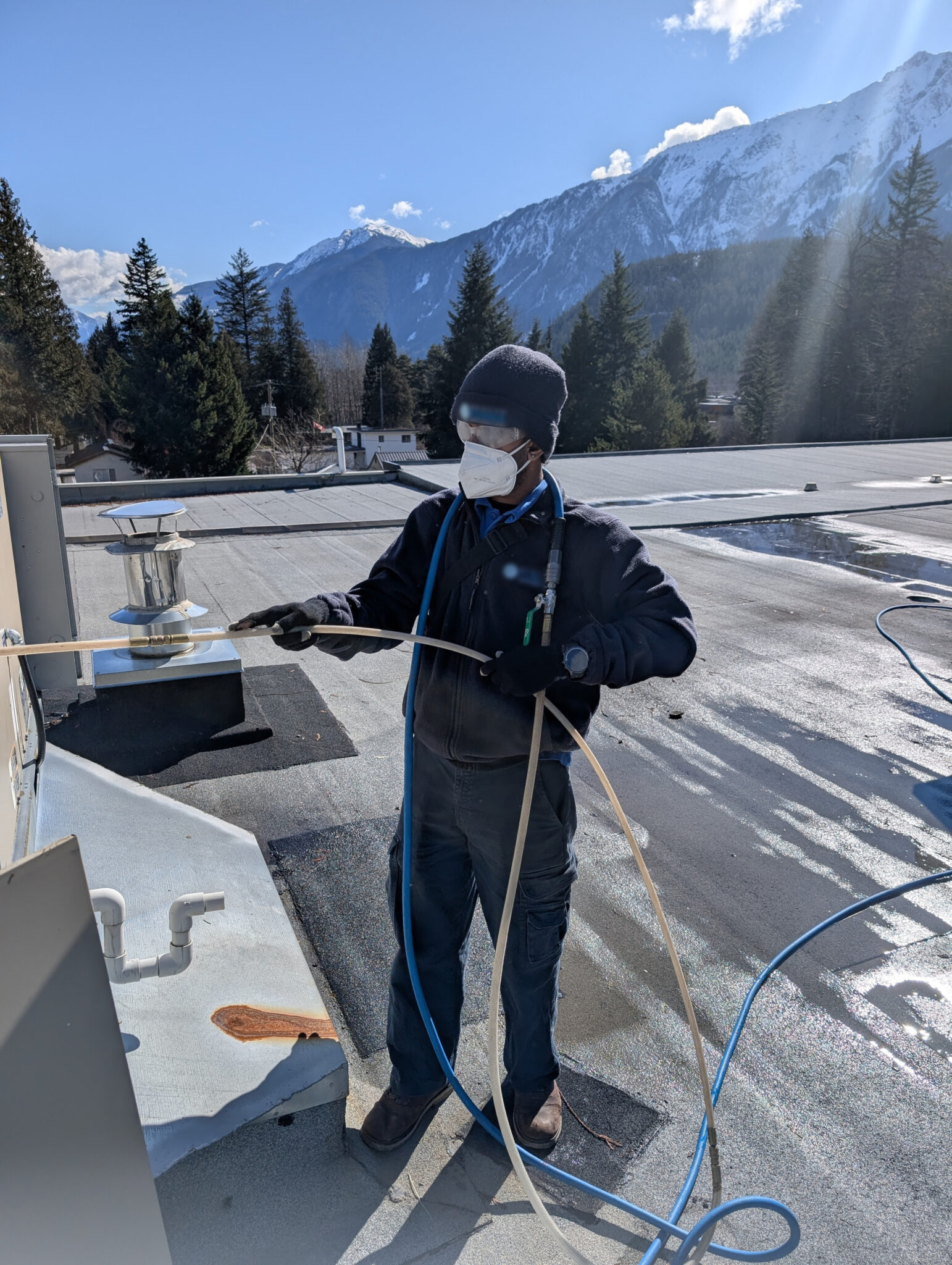Narada doing HVAC work on a rooftop.