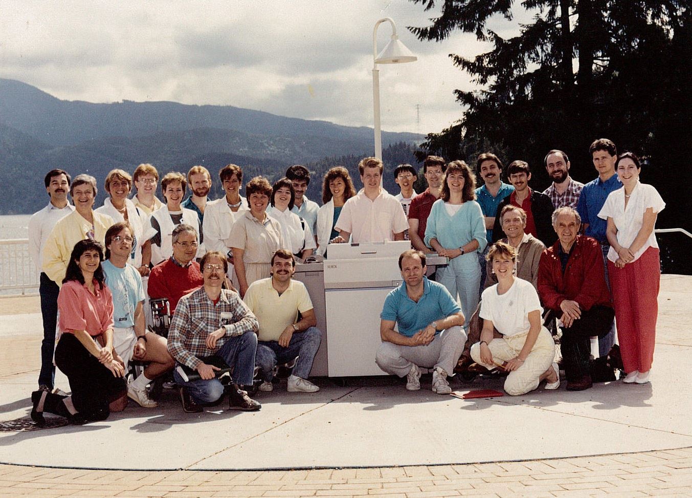 Neil Squire staff in the 1980's pose with their new Xerox machine in Deep Cove.