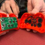 The internal working of a toy, including the circuit board.