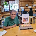 Vince with a cake wishing him a