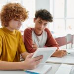 Two students work together on homework.