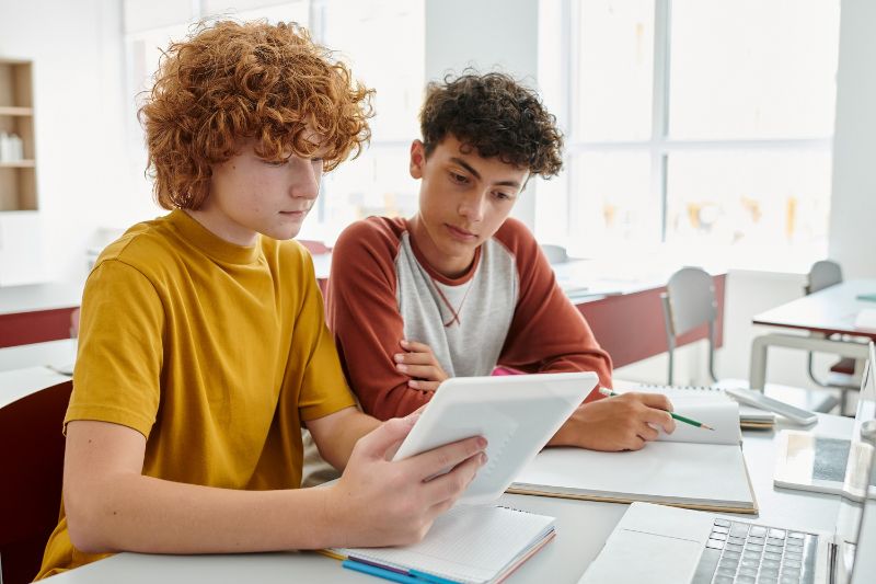 Two students work together on homework.