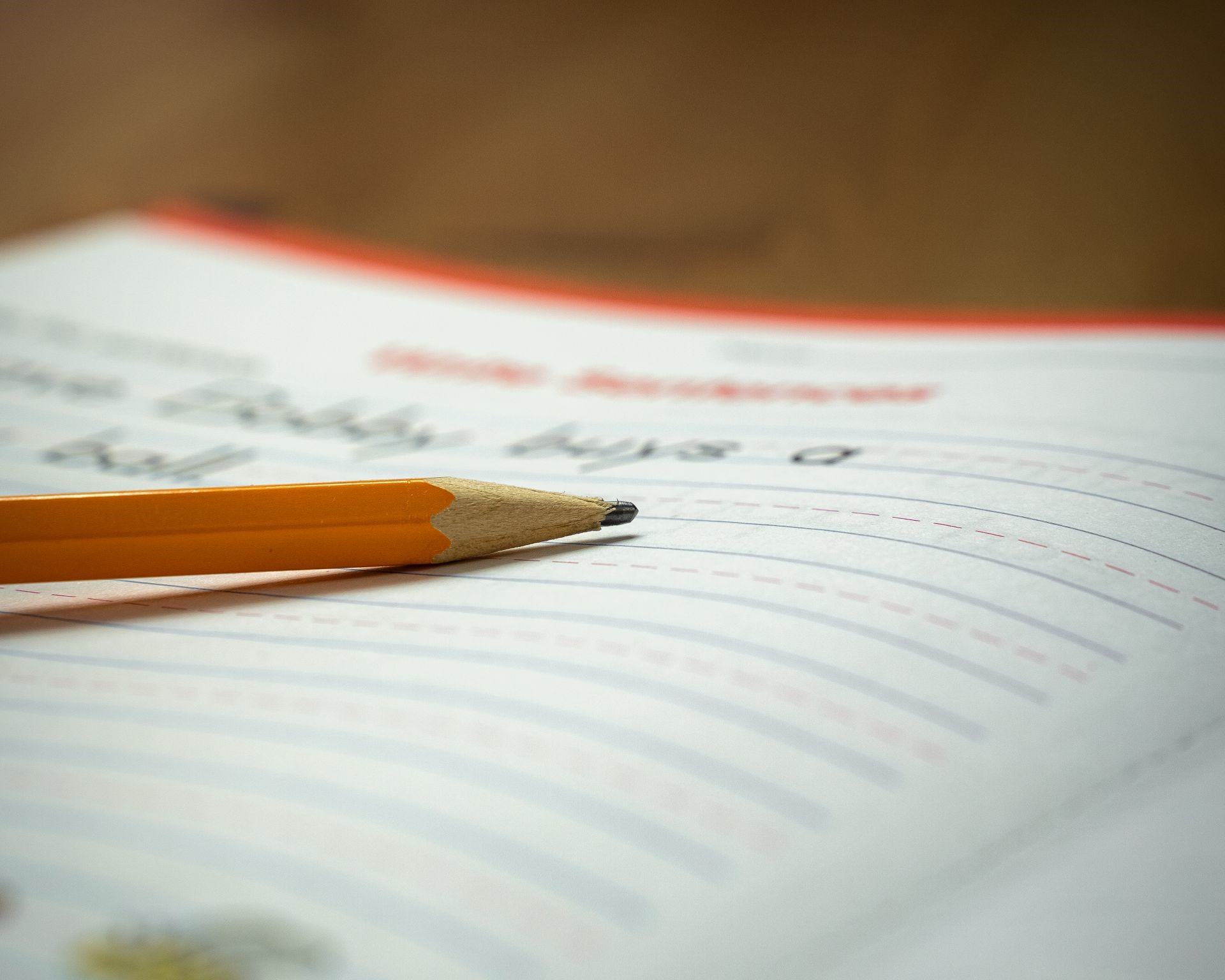A pencil sits on a student's notebook.