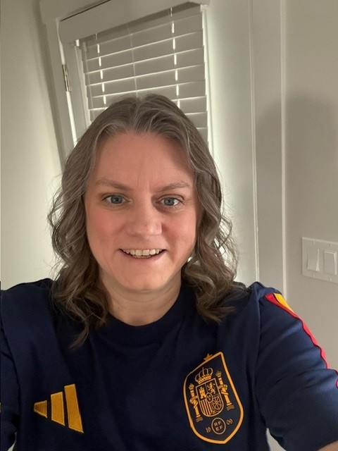 WorkBC Assistive Technology Services participant Mandy wearing a soccer jersey.