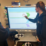 Gordon and Jody work with the SMART Board