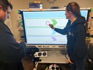 Gordon and Jody work with the SMART Board