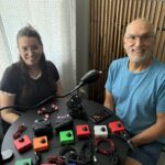 Alyssa and Jody showing off the devices they've built, including many Cedar joysticks and a LipSync.