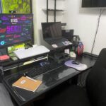 Kaysee's new home office setup with dual monitors, keyboard, mouse, and organized desk accessories.