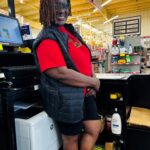 Viola at work as a cashier in a hardware store.