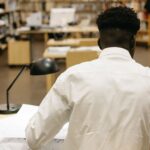 A man studies in the library.