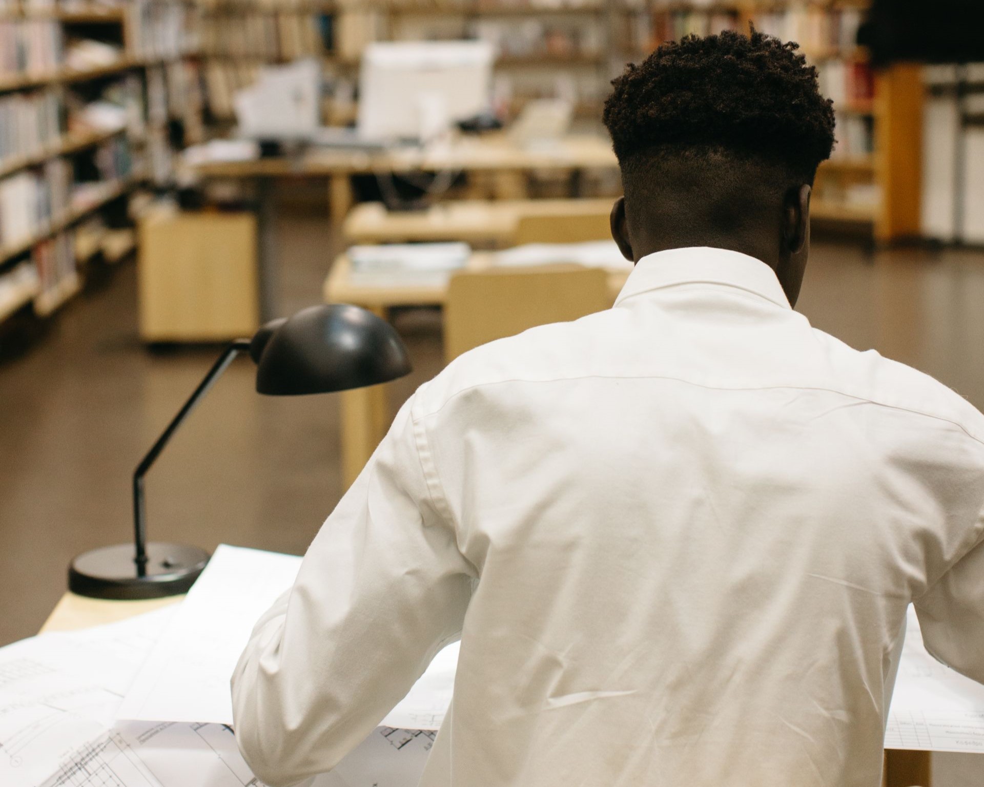 A man studies in the library.