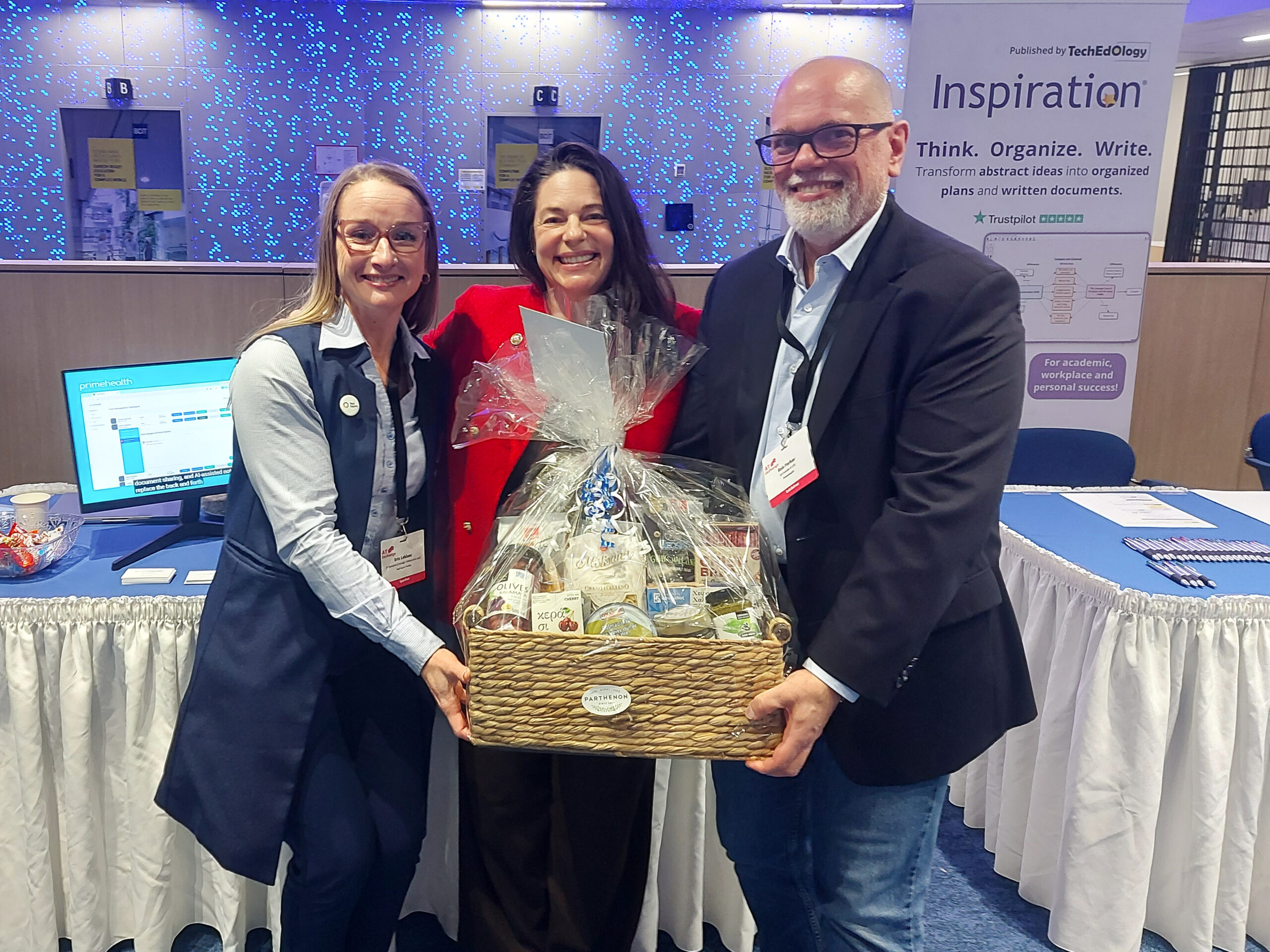 Erin, left, receives a gift basket.