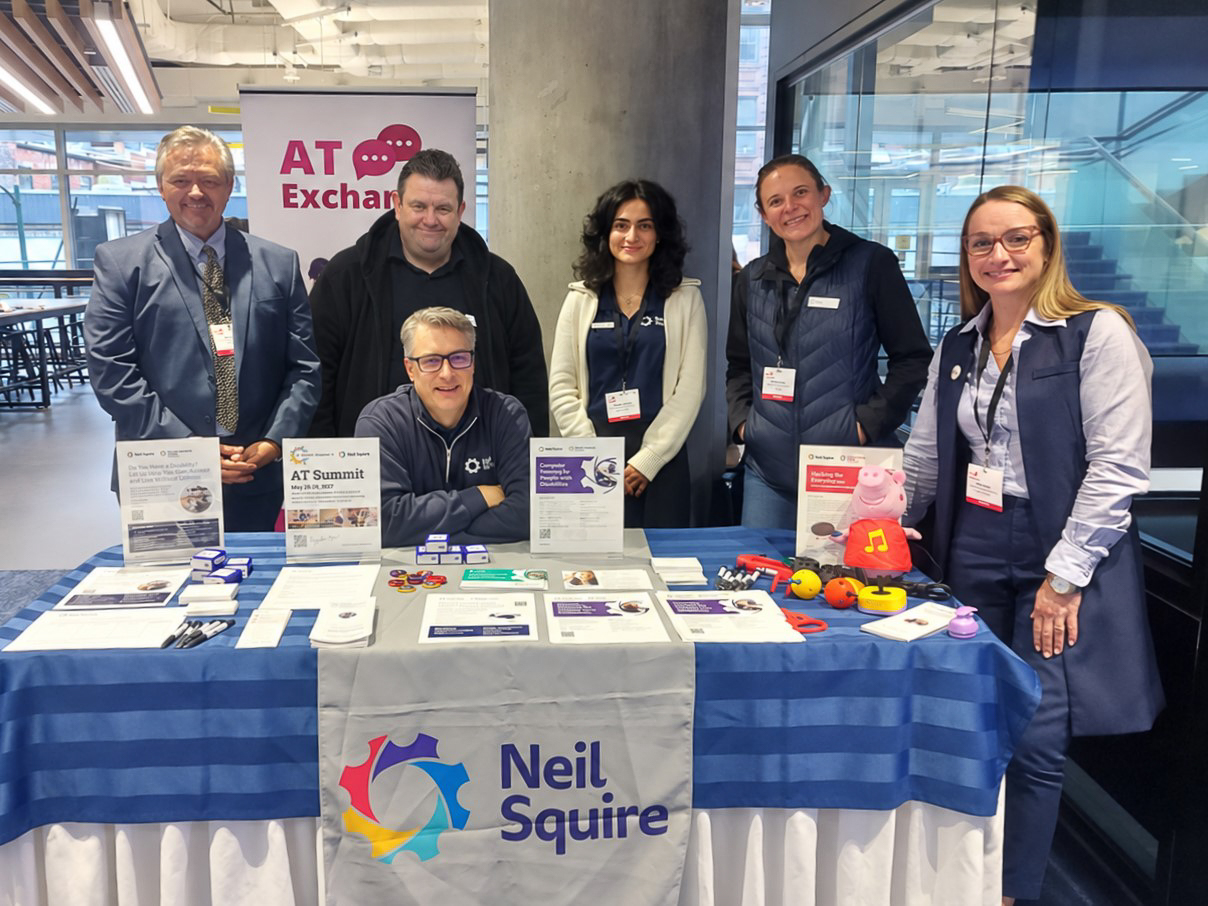 The Neil Squire team at the Neil Squire table.