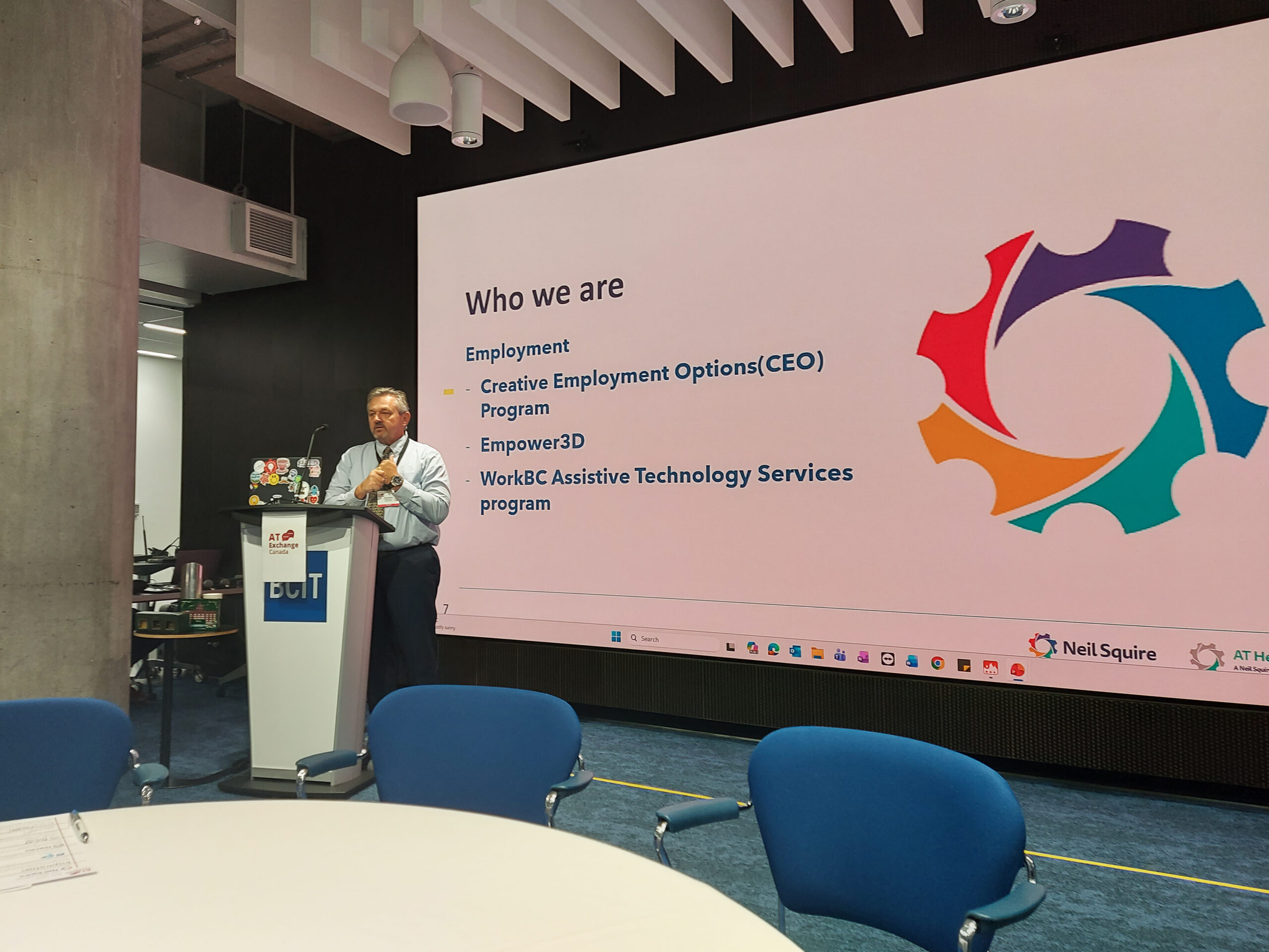 Nate presenting, with our programs Creative Employment Options, Empower3D, and WorkBC Assistive Technology Services on the slide.